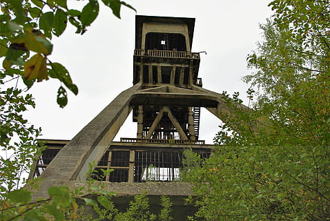 mining, industry, work, construction, architecture, factory, extraction, tree, plant, built structure, low angle view, building exterior, nature, building, sky, no people, day, tower, clear sky, green color, history, growth, outdoors, the past, religion, belief, clock, 2K, CC0, public domain, royalty free