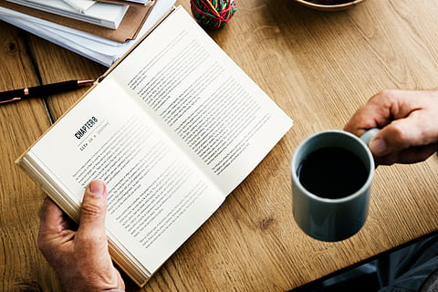 book, table, read, knowledge, wisdom, coffee, people, hand, man, mug, chapters, wood, pen, school, study, human hand, human body part, publication, cup, drink, paper, coffee cup, adult, coffee - drink, food and drink, indoors, one person, refreshment, holding, body part, finger, crockery, 5K, CC0, public domain, royalty free