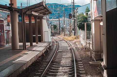 train, tracks, train station, rail transportation, track, railroad track, transportation, the way forward, day, direction, architecture, plant, no people, built structure, tree, nature, public transportation, mode of transportation, building exterior, outdoors, diminishing perspective, sky, signal, long, station, parallel, 5K, CC0, public domain, royalty free
