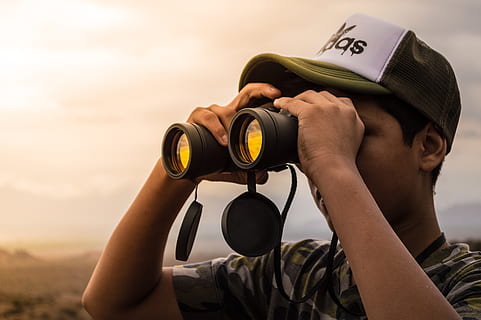 man, looking, binoculars, sunset, binocular, cap, clouds, daylight, fashion, person, sunlight, wear, holding, one person, headshot, sky, nature, portrait, men, adult, cloud - sky, outdoors, real people, occupation, leisure activity, day, mid adult, activity, 5K, CC0, public domain, royalty free