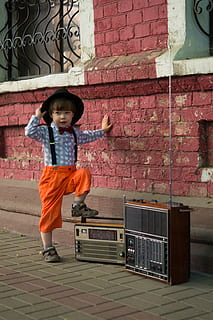 boy, stepping, boombox, brick wall, child, cute, fashion, kid, pavement, street, wear, young, childhood, full length, one person, real people, looking at camera, architecture, wall - building feature, casual clothing, males, built structure, portrait, females, wall, lifestyles, front view, boys, brick, innocence, 5K, CC0, public domain, royalty free