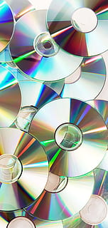discos compactos, CD ROM, cubrir, datos, digital, disco, DVD, vacío, película, juegos, información, medios de comunicación, multimedia, música, nadie, abierto, embalaje, el plastico, rayo, software, sonar, almacenamiento, vídeo, multi color, fotograma completo, antecedentes, disco compacto, modelo, de cerca, adentro, diseño, forma, vista de alto ángulo, forma geometrica, naturaleza muerta, foto de estudio, circulo, transparente, gran grupo de objetos, material de vidrio, reflexión, tecnología, resumen, vaso, lujo, 2K