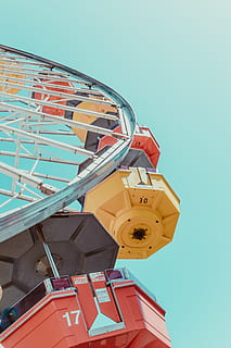 assorted-color ferriswheel, low angle view, sky, clear sky, built structure, amusement park ride, architecture, amusement park, no people, nature, blue, day, ferris wheel, building exterior, outdoors, arts culture and entertainment, yellow, tower, sunlight, metal, tilt, 5K, CC0, public domain, royalty free
