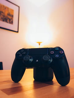 black, sony, ps4, dualshock, 4, tabletop, computer, controller, electronics, equipment, gaming, playstation, technology, wireless, indoors, photography themes, communication, no people, table, close-up, home interior, arts culture and entertainment, domestic room, camera - photographic equipment, flooring, retro styled, furniture, relaxation, wireless technology, wood, still life, connection, 5K, CC0, public domain, royalty free
