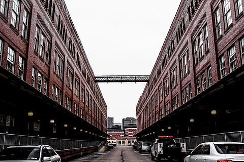 building, structure, architecture, sidewalk, alley, window, lights, bulb, patrol, car, vehicle, road, street, park, transportation, travel, city, sky, built structure, motor vehicle, mode of transportation, building exterior, land vehicle, day, incidental people, bridge, nature, bridge - man made structure, clear sky, outdoors, diminishing perspective, 5K, CC0, public domain, royalty free