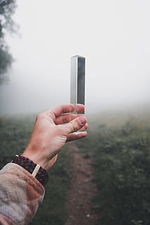 person, holding, gray, steel box, object, triangle, hand, hold, bokeh, blur, foggy, reflection, glass, mirror, vsco, folk, explore, mountain, nature, fog, mobile Phone, smart Phone, human Hand, telephone, technology, outdoors, people, communication, wireless Technology, mobility, one Person, women, text Messaging, equipment, close-up, men, internet, human Finger, lifestyles, touch Screen, caucasian Ethnicity, females, global Communications, touching, adult, using Phone, 5K, CC0, public domain, royalty free