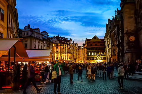 prague sunset, city and Urban, large group of people, building exterior, crowd, architecture, group of people, built structure, city, real people, women, illuminated, building, men, sky, street, adult, lifestyles, dusk, walking, city life, outdoors, street market, 2K