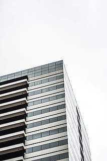gray concrete building, building, office building, town, high rise, urban, city, apartment building, staircase, architecture, archictecture, home decor, asphalt, tarmac, road, intersection, transportation, car, automobile, sports car, vehicle, building exterior, built structure, sky, low angle view, clear sky, office, office building exterior, copy space, nature, modern, no people, day, window, outdoors, tall - high, glass - material, skyscraper, 5K, CC0, public domain, royalty free