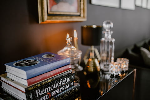 decanter, candles, painting, wall, interior, home, magazines, essentials, books, decor, decorations, elegant, warm, indoors, glamour, cosy, cozy, elegance, food and drink, no people, arts culture and entertainment, table, focus on foreground, publication, music, glass, drink, container, refreshment, still life, text, drinking glass, close-up, book, design, selective focus, 5K