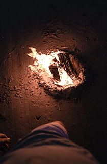 bonfire during nighttime, fire, flame, bonfire, person, human, dungeon, crypt, tunnel, night life, forge, light, flare, goblet, glass, hearth, accessories, ornament, accessory, jewelry, bead, burning, heat - temperature, low section, personal perspective, fire - natural phenomenon, one person, human body part, nature, men, high angle view, human leg, glowing, body part, night, illuminated, indoors, real people, 5K, CC0, public domain, royalty free