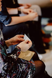 women, folding, sheet, paper, making, origami, creative, workshop, handmade, artwork, craft, japan, real people, human hand, hand, indoors, lifestyles, focus on foreground, people, midsection, holding, sitting, adult, human body part, leisure activity, incidental people, selective focus, business, two people, food and drink, nail, finger, 5K, CC0, public domain, royalty free