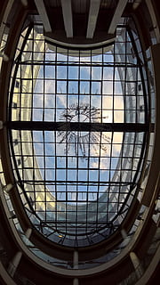 low, angle mirror, framed, ceiling bulding, architecture, building, ceiling, design, glass, indoors, low angle shot, perspective, glass - material, built structure, geometric shape, shape, skylight, transparent, pattern, no people, window, day, sunlight, circle, dome, low angle view, nature, directly below, architecture and art, 5K, CC0, public domain, royalty free