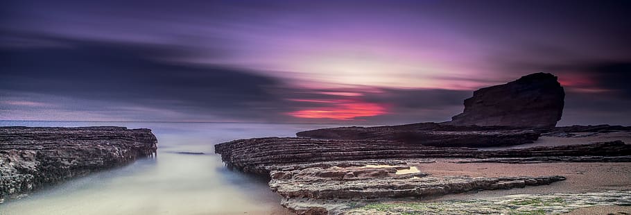 sunset, panoramic, water, dawn, nature, rock - object, sky, rock, beauty in nature, solid, scenics - nature, cloud - sky, environment, rock formation, landscape, land, no people, dramatic sky, long exposure, travel destinations, travel, sea, purple, power in nature, 5K