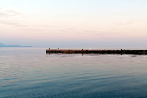 pier, calm, ocean, waterfront, morning, dawn, sea, peaceful, tranquil, tranquility, quiet, flat, water, sky, scenics - nature, beauty in nature, tranquil scene, sunset, cloud - sky, nature, idyllic, non-urban scene, reflection, no people, architecture, built structure, horizon, horizon over water, outdoors, 1080P, CC0, public domain, royalty free