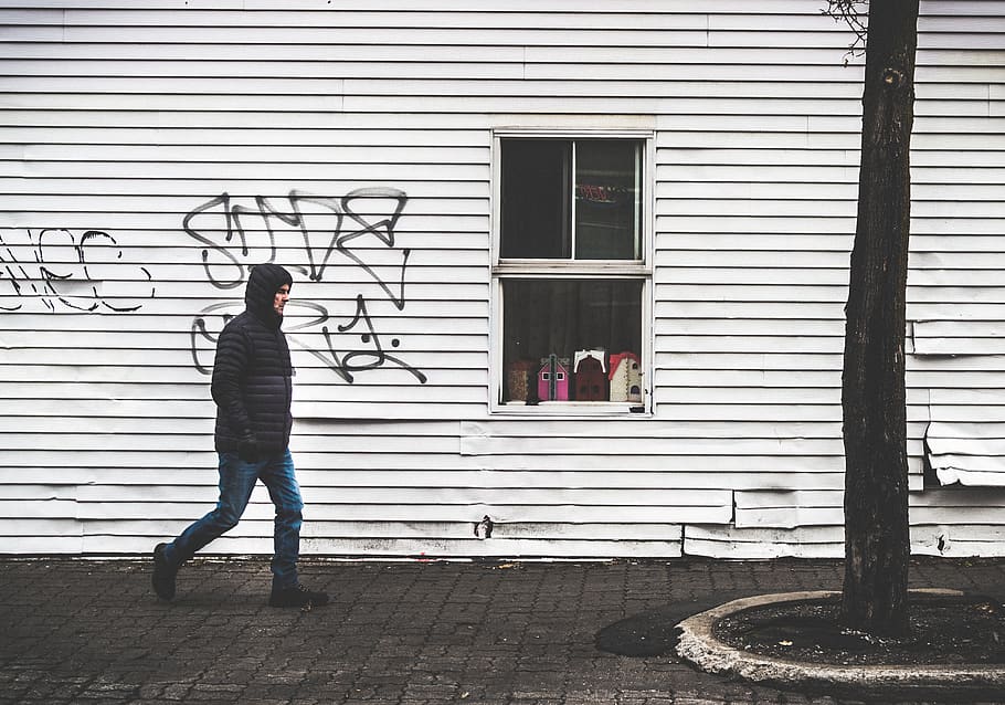 man, window, graffiti, tree, urban, street, full length, architecture, one person, real people, building exterior, built structure, day, shutter, standing, building, lifestyles, side view, closed, outdoors, leisure activity, entrance, men, door, iron, 2K