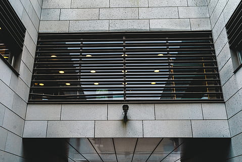 architecture, building, infrastructure, structure, establishment, windows, cctv, camera, built structure, one person, real people, building exterior, pattern, day, lifestyles, men, staircase, low angle view, rear view, outdoors, wall - building feature, walking, window, city, modern, 5K, CC0, public domain, royalty free