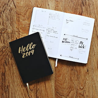 black, hello, 2019 notebook, brown, wooden, surface, 2019, desk, diary, document, flatlay, handwriting, note, notebook, page, planner, planning, writing, communication, text, wood - material, western script, indoors, no people, still life, table, high angle view, paper, close-up, business, book, non-western script, script, label, number, publication, directly above, wood grain, 2K, CC0, public domain, royalty free