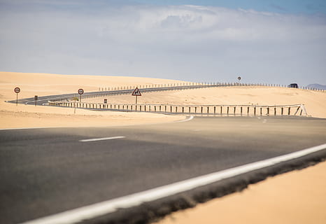 gray-paved road, nature, soil, outdoors, sand, road, asphalt, tarmac, scenery, landscape, desert, panoramic, dune, highway, way, sky, horizon, airport, airfield, island, dessert, scenics - nature, day, no people, tranquil scene, tranquility, architecture, land, beauty in nature, focus on background, sunlight, cloud - sky, built structure, water, environment, arid climate, 4K, CC0, public domain, royalty free