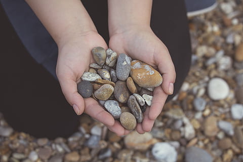pebbles, rocks, hands, beach, human hand, hand, human body part, one person, real people, holding, lifestyles, food, focus on foreground, body part, food and drink, unrecognizable person, high angle view, large group of objects, stone - object, leisure activity, day, solid, hands cupped, outdoors, finger, pebble, human limb, 1080P, CC0, public domain, royalty free