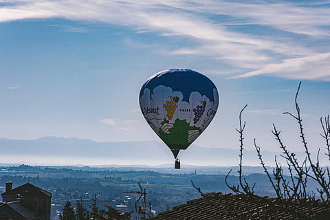 blue, white, hot, air balloon, balloon, clouds, daylight, flight, hot air balloon, houses, landscape, outdoors, scenic, sight, sky, mountain, nature, environment, architecture, cloud - sky, scenics - nature, no people, transportation, building exterior, water, built structure, day, mountain range, travel, mid-air, digital composite, 5K, CC0, public domain, royalty free