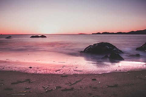 beach, sunset, sky, clouds, scenery, ocean, rocks, landscape, sea, land, water, beauty in nature, scenics - nature, horizon over water, horizon, tranquility, motion, nature, long exposure, tranquil scene, coastline, seascape, sand, solid, no people, romantic sky, 4K, CC0, public domain, royalty free