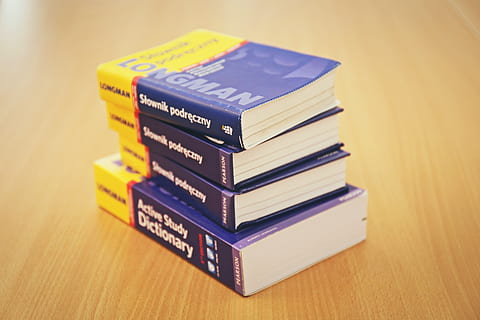 books, dictionary, reading, study, school, learning, education, desk, stack, indoors, table, still life, text, no people, wood - material, close-up, book, communication, publication, group of objects, western script, focus on foreground, medium group of objects, expertise, studio shot, yellow, hardcover book, 5K, CC0, public domain, royalty free