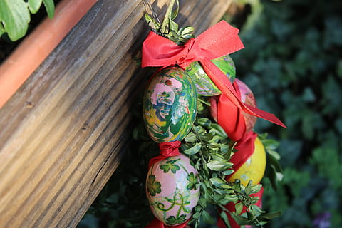 easter, easter eggs, egg, colorful, colored, spring, color, easter theme, easter decoration, easter egg, easter decorations, day, close-up, celebration, plant, bow, focus on foreground, tied bow, ribbon, art and craft, no people, nature, wood - material, ribbon - sewing item, decoration, outdoors, red, holiday, craft, creativity, 5K, CC0, public domain, royalty free