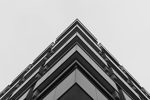 skyscraper, building, window, sky, structure, architecture, infrastructure, angle, black and white, built structure, low angle view, building exterior, clear sky, no people, copy space, day, nature, triangle shape, modern, corner, office building exterior, city, outdoors, pattern, shape, geometric shape, directly below, 5K, CC0, public domain, royalty free