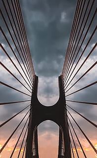 low, angle shot, suspension bridge, architecture, bridge, clouds, low angle shot, perspective, sky, steel, cloud - sky, built structure, connection, bridge - man made structure, low angle view, engineering, nature, cable-stayed bridge, storm cloud, storm, transportation, dusk, cable, overcast, outdoors, office building exterior, skyscraper, directly below, 2K, CC0, public domain, royalty free