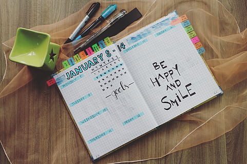 motivational quote, date, handwriting, note, notebook, page, pens, planner, writing, text, paper, indoors, western script, table, pen, education, communication, number, wood - material, high angle view, learning, people, childhood, reminder, creativity, close-up, note pad, message, to do list, 4K, CC0, public domain, royalty free
