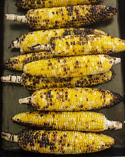 grilled corns, food and drink, food, corn, freshness, yellow, sweetcorn, wellbeing, healthy eating, vegetable, no people, roasted, corn on the cob, barbecue, close-up, in a row, retail, stack, market, still life, high angle view, outdoors, preparation, snack, 4K, CC0, public domain, royalty free