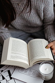 woman, sweater, reads, book, reading, reader, opened book, girl, female, lifestyle, relax, time, candle, pullover, jumper, publication, one person, holding, real people, education, indoors, human hand, adult, hand, activity, women, sitting, paper, front view, learning, lifestyles, open, studying, 1080P