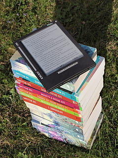 blue, pink, gray, green, labeled, hardbound, book pile, grass, daytime, books, e-book, knowledge, literature, novels, screen, technology, touch screen, field, land, day, plant, no people, nature, stack, music, publication, book, high angle view, close-up, communication, outdoors, paper, musical instrument, education, arts culture and entertainment, 4K, CC0, public domain, royalty free