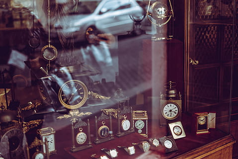 assorted-color pocket watches, design, glass window, inside, reflection, stock, technology, time, clock, indoors, retro styled, instrument of time, transparent, watch, glass - material, no people, antique, large group of objects, table, collection, retail, variation, still life, choice, container, wristwatch, retail display, pocket watch, clock face, wall clock, 4K, CC0, public domain, royalty free