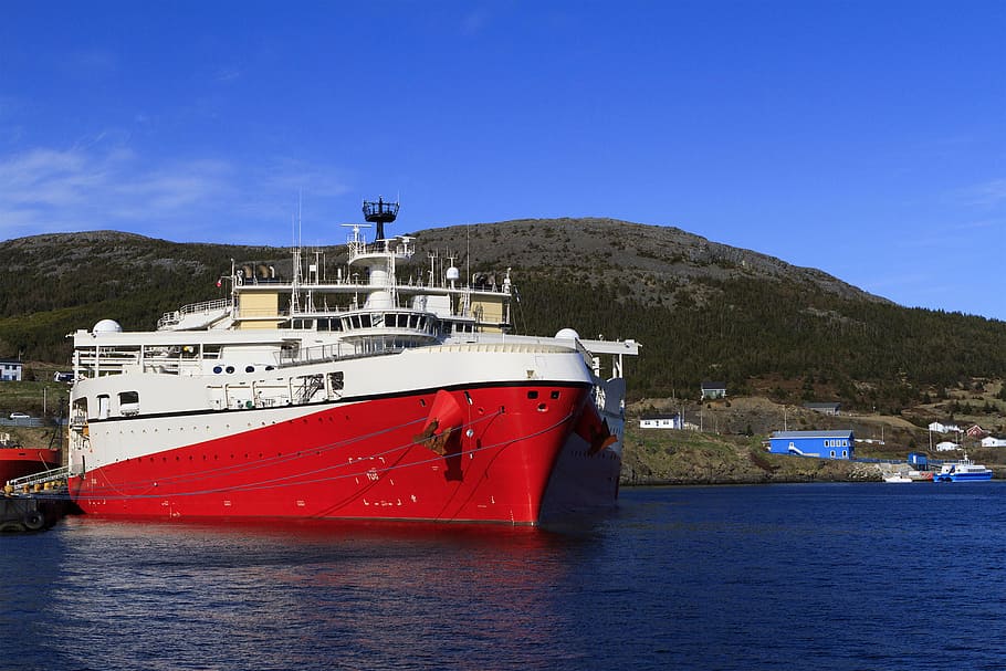 offshore, seismic, vessel, port, survey, ship, boat, rig, platform, supply ship, subsea, sky, water, sea, ocean, marine, maritime, petroleum, oil, gas, newfoundland and labrador, canada, supply, materials, industrial, transportation, atlantic, safety, nautical, navigation, energy, harbor, underwater, seismology, science, research, nautical vessel, mode of transportation, nature, no people, architecture, mountain, built structure, red, land, blue, beach, moored, outdoors, guidance, passenger craft, cruise ship, anchored, 2K