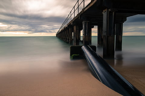 architecture, bridge, structure, blue, sky, cloud, horizon, sea, water, sand, beach, metal, steel, shore, coast, cloud - sky, built structure, nature, connection, horizon over water, scenics - nature, pier, transportation, bridge - man made structure, sunset, tranquil scene, no people, beauty in nature, architectural column, 5K, CC0, public domain, royalty free