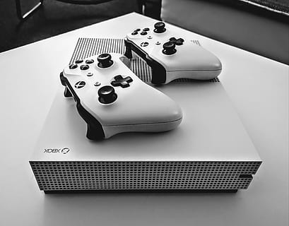 xbox, games, game console, console, still life, table, indoors, close-up, no people, high angle view, arts culture and entertainment, luck, focus on foreground, leisure games, finance, number, communication, business, gambling, cut out, opportunity, guitar, studio shot, relaxation, 2K, CC0, public domain, royalty free