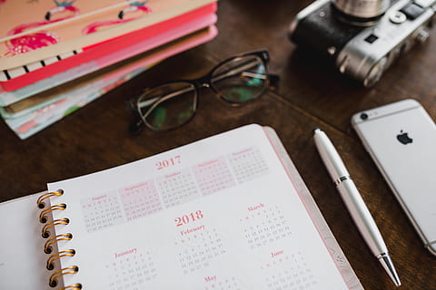 pink calendar, calendar, notebook, diary, note, desk, glasses, eyeglasses, paper, pen, indoors, pencil, no people, high angle view, table, publication, text, book, document, note pad, communication, close-up, handwriting, sunglasses, list, reading glasses, 5K, CC0, public domain, royalty free