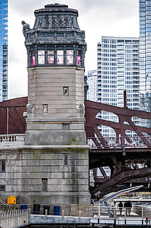 gray building, building, architecture, human, person, tower, arched, arch, bridge, city, town, metropolis, urban, steeple, spire, office building, arch bridge, lighthouse, beacon, brick, dome, built structure, building exterior, bridge - man made structure, travel destinations, sky, connection, day, low angle view, travel, tourism, no people, nature, outdoors, tall - high, transportation, office building exterior, skyscraper, 5K, CC0, public domain, royalty free