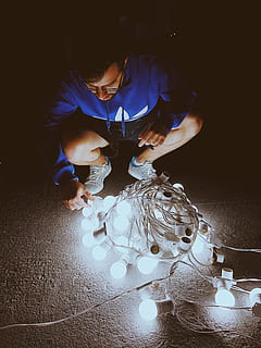 man, fixing, light bulb string, art, color, dark, electricity, energy, lights, person, string light bulbs, string lights, technology, wear, wire, illuminated, real people, indoors, one person, lighting equipment, glowing, table, men, lifestyles, front view, burning, high angle view, fire, light - natural phenomenon, flame, decoration, candle, fire - natural phenomenon, business, light, electric lamp, 4K, CC0, public domain, royalty free