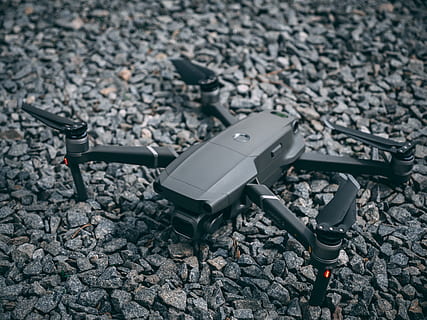 gray quadcopter drone, digital device, drone, quadcopter, stones, technology, high angle view, no people, transportation, day, close-up, focus on foreground, solid, stone - object, nature, rock, outdoors, mode of transportation, rock - object, gun, photography themes, city, connection, equipment, still life, 4K, CC0, public domain, royalty free