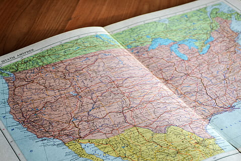 map, navigation, directions, USA, travel, trip, vacation, close-up, direction, guidance, no people, indoors, journey, exploration, physical geography, selective focus, high angle view, still life, discovery, world map, travel destinations, road, road trip, searching, 4K