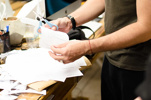 white printer paper, cup, lab, furniture, holding, human hand, hand, midsection, indoors, men, paper, business, people, human body part, standing, occupation, focus on foreground, food and drink, real people, cafe, working, table, body part, human limb, 4K, CC0, public domain, royalty free