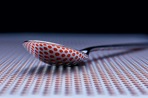 table, tabletop, spoon, object, metal, texture, metallic, indoors, close-up, selective focus, no people, studio shot, technology, pattern, red, single object, still life, copy space, connection, computer equipment, communication, black color, arts culture and entertainment, science, positive emotion, blue, 4K, CC0, public domain, royalty free
