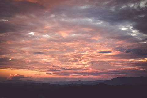 mountains during sunset, nature, outdoors, sky, cloud, dawn, sunset, dusk, red sky, sunrise, mountain, mountain range, weather, cumulus, scenery, peak, landscape, sunlight, horizon, panoramic, countryside, cloud - sky, beauty in nature, scenics - nature, tranquility, tranquil scene, orange color, dramatic sky, environment, idyllic, no people, awe, silhouette, majestic, bright, 4K, CC0, public domain, royalty free