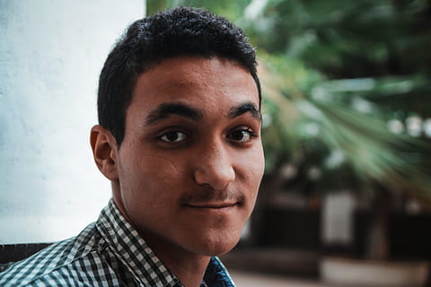 man's face, face, person, human, smile, portrait, head, man, photography, photo, outdoors, apparel, clothing, shirt, boy, hair, plant, selfie, dimples, worker, jaw, headshot, looking at camera, one person, real people, focus on foreground, young adult, close-up, lifestyles, young men, front view, leisure activity, casual clothing, body part, human body part, day, black hair, human face, 5K, CC0, public domain, royalty free