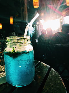 mojito, cafe, evening, sunset, drink, food and drink, refreshment, table, household equipment, close-up, focus on foreground, freshness, glass, drinking glass, incidental people, food, jar, cold temperature, indoors, still life, glass - material, straw, container, mint leaf - culinary, 2K, CC0, public domain, royalty free