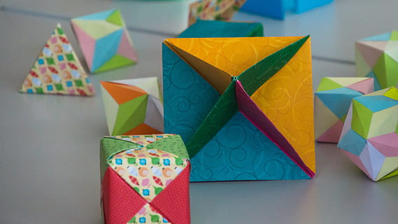 math, forms, geometry, cube, shape, pattern, paper, papercraft, fold, folded, geometric, school, origami, colorful, multi colored, indoors, creativity, no people, art and craft, still life, close-up, celebration, studio shot, variation, group of objects, triangle shape, focus on foreground, box, large group of objects, 4K, CC0, public domain, royalty free