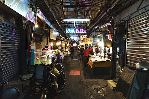 gray shutter door, group of people, market, real people, architecture, illuminated, shopping, built structure, store, people, retail, indoors, business, men, market stall, crowd, group, city, occupation, night, ceiling, 4K, CC0, public domain, royalty free