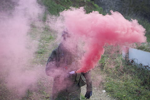 airsfot, forest, trees, man, soldier, weapon, candle, smoke, one person, day, smoke - physical structure, motion, pink color, nature, land, real people, field, enjoyment, standing, outdoors, side view, lifestyles, fun, men, leisure activity, adult, casual clothing, dust, arms raised, 2K, CC0, public domain, royalty free